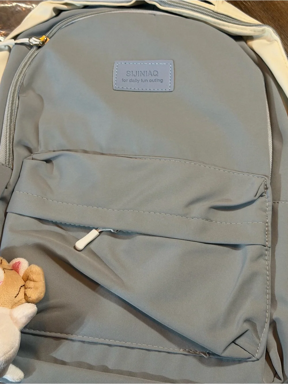 Light Gray Canvas Backpack with Cream Sides